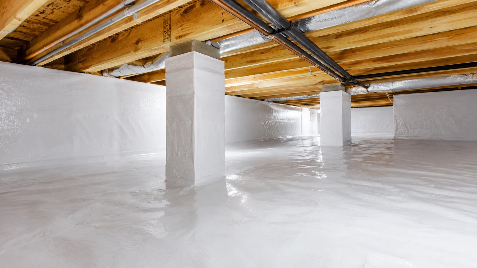 Clean encapsulated crawl space interior with white vapor barrier liner